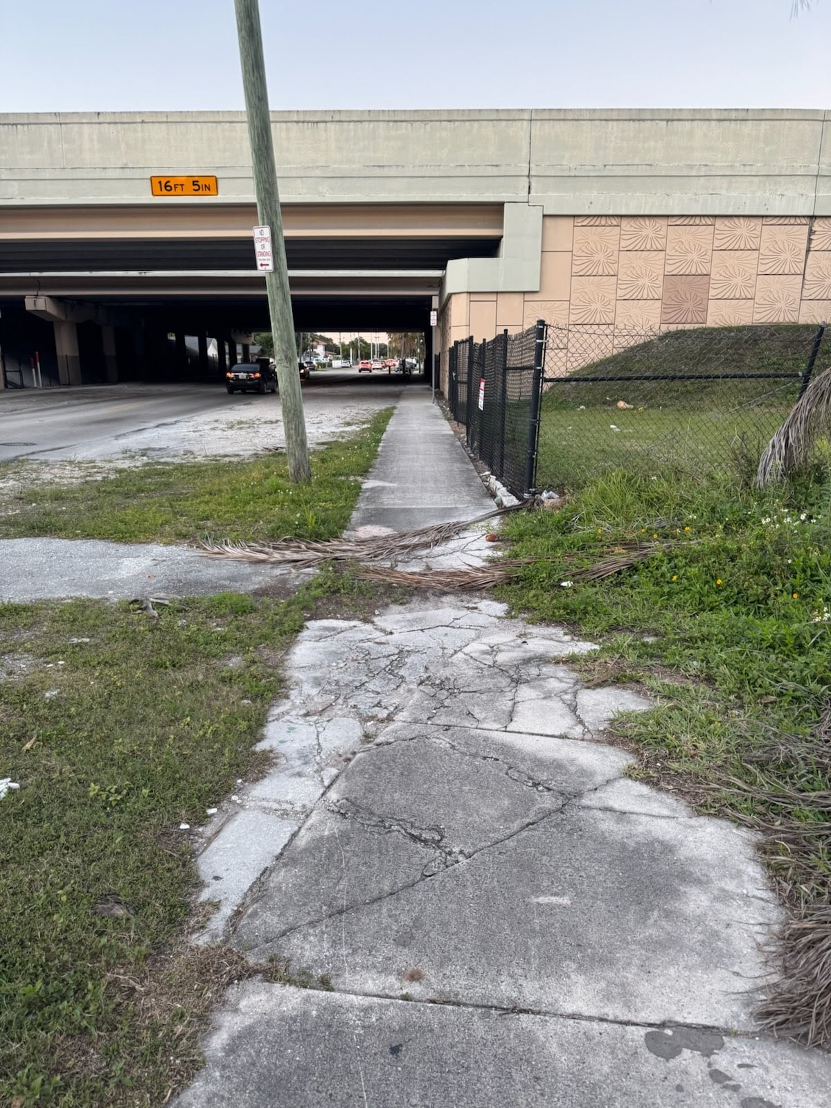 Damaged sidewalk before repair