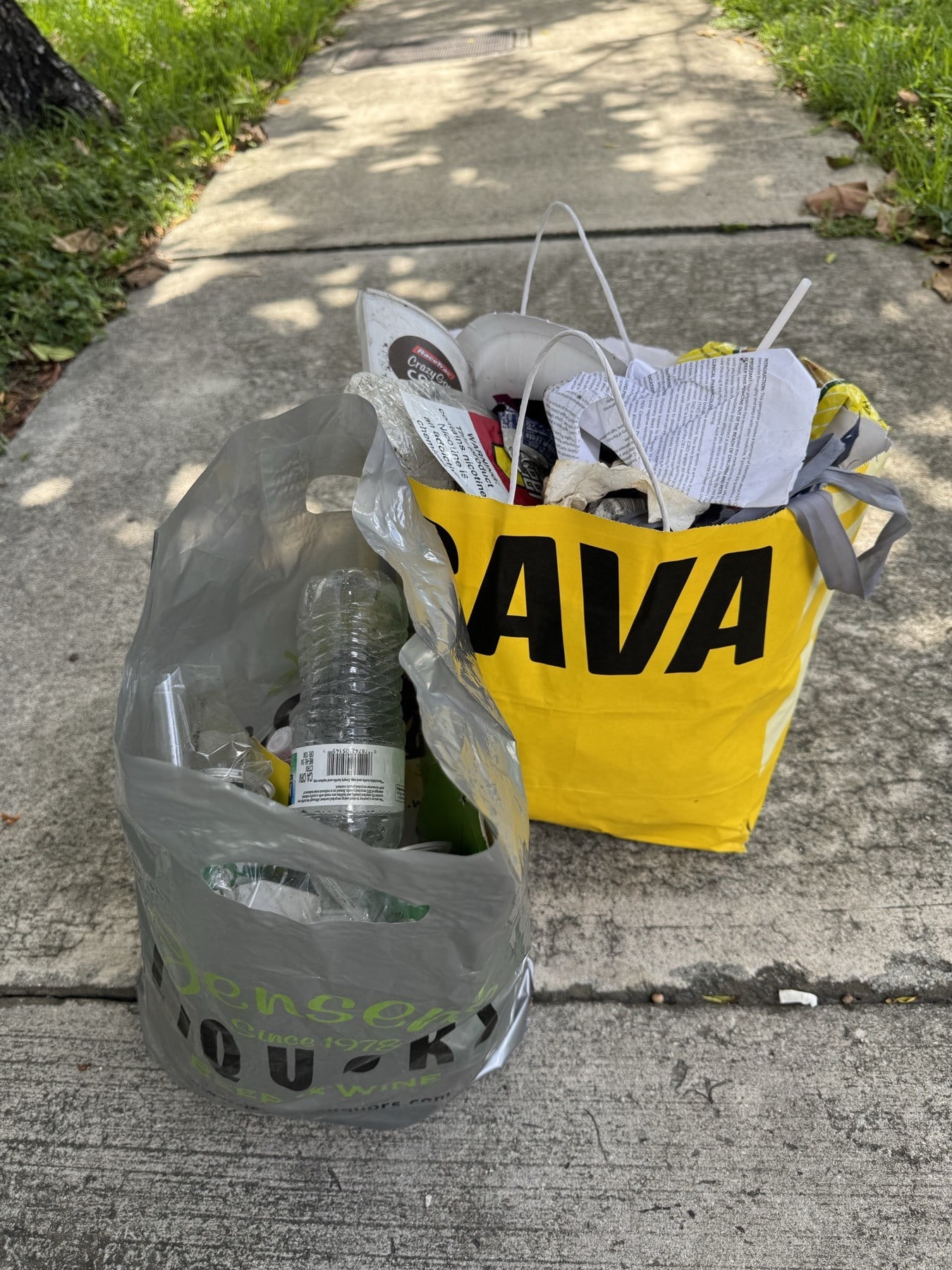 An illegally posted rent sign and litter cleared from the grass